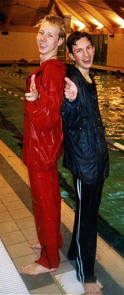 Pool attendants swim in uniform